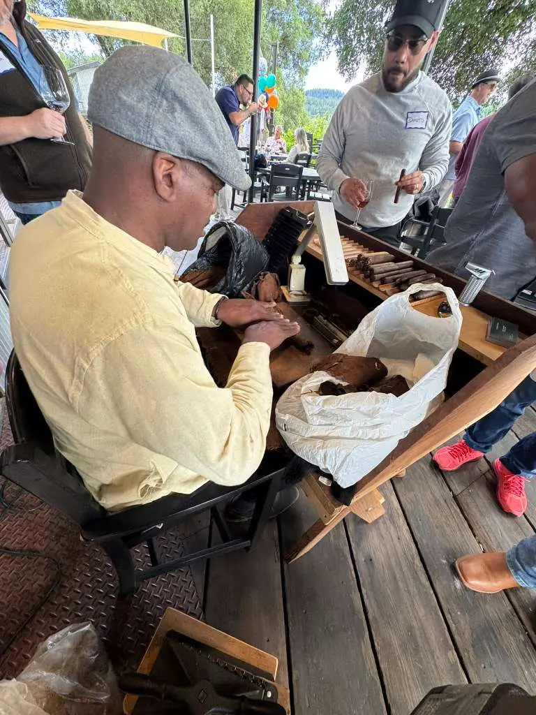 Antonio Cortada providing live cigar rolling entertainment during a corporate event in the Bay Area.